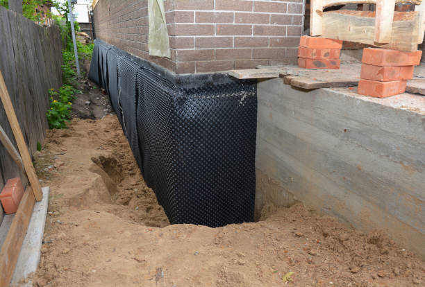 Happy homeowners after waterproofing job in Saint Joe
